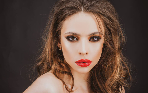 Elegant woman with red lips and smokey eyes makeup. Closeup face with make-up. - Fotoğraf, Görsel