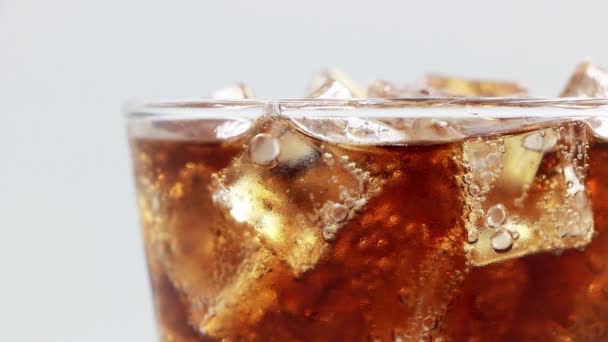 Cola with ice cubes close-up. Cola with Ice in glass. Coke Soda closeup.  - Footage, Video