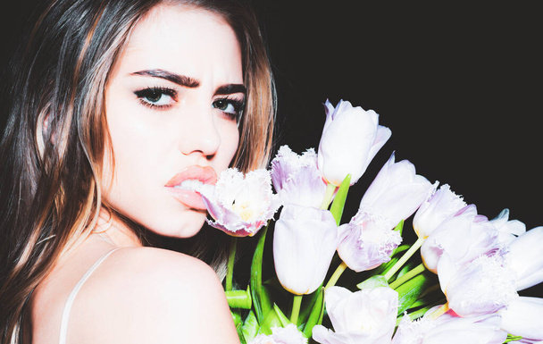 Portrait of sexy sensual young woman with flowers. Face close-up. Florist advert. - Foto, Imagem