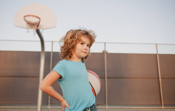Basketball kids player. Hobby, active lifestyle, sports activity for kids. - Zdjęcie, obraz