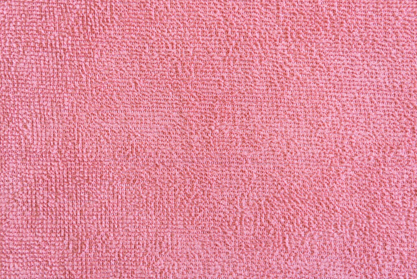 close-up licht roze microvezel textuur. Reiniging vodden pluizige doek - Foto, afbeelding