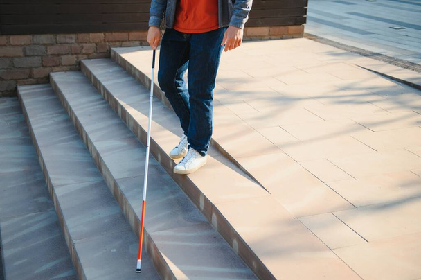 Blind Man Walking On Sidewalk Holding Stick. - Photo, Image