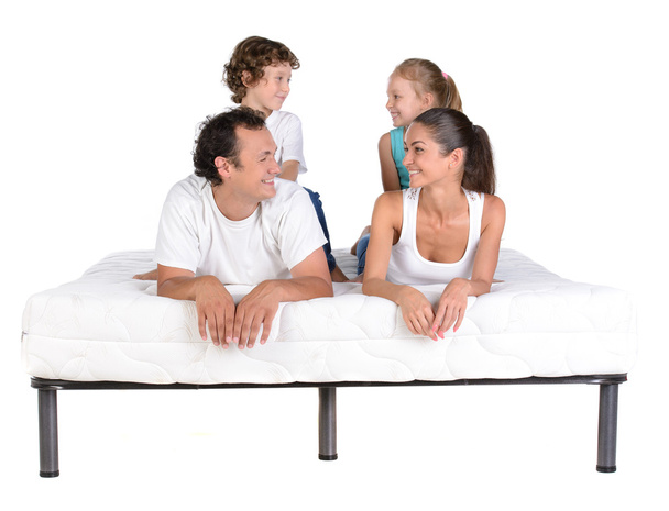 Family on the mattress - 写真・画像