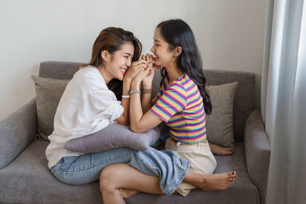 lgbtq, lgbt concept, homosexuality, portrait of two Asian women posing happy together and showing love for each other while being together - Valokuva, kuva