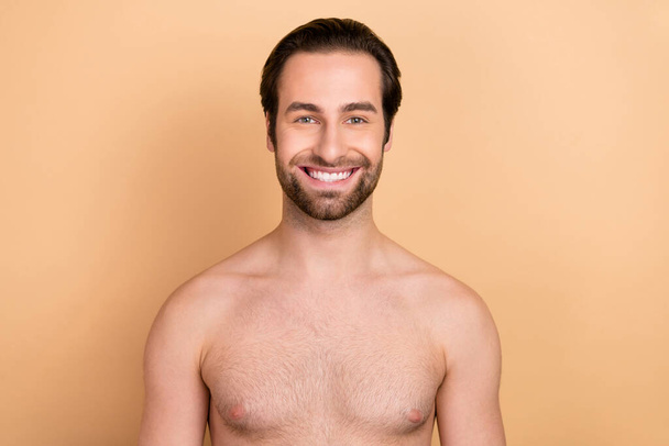 Photo of young cheerful guy toothy smile enjoy salon procedure freshness isolated over beige color background - Φωτογραφία, εικόνα