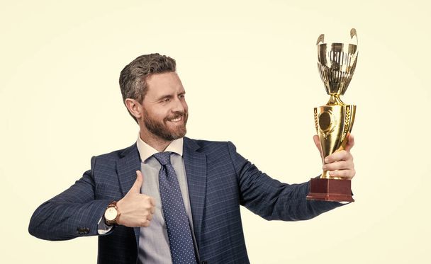 Reward for work. Happy ceo show thumbs up to golden cup. Reward and recognition - 写真・画像