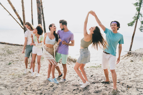 Photo of pretty funky young people wear casual clothes dancing beach party outside countryside - Zdjęcie, obraz