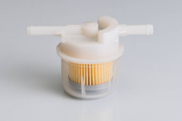 Plastic fuel filter for diesel and gasoline engines on a white background. - Photo, Image