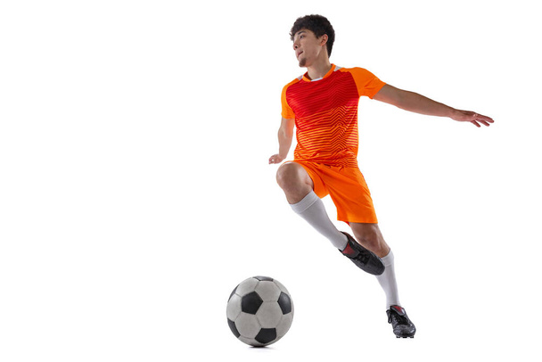 Professional football, soccer player in motion isolated on white studio background. Concept of sport, match, active lifestyle, goal and hobby - Foto, imagen