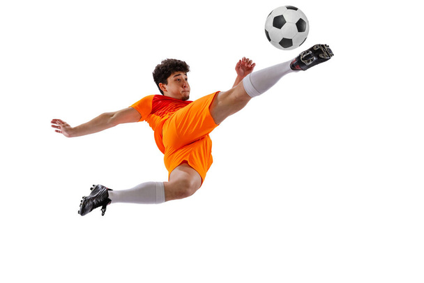 Professional football, soccer player in motion isolated on white studio background. Concept of sport, match, active lifestyle, goal and hobby. Wide angle view - Photo, image