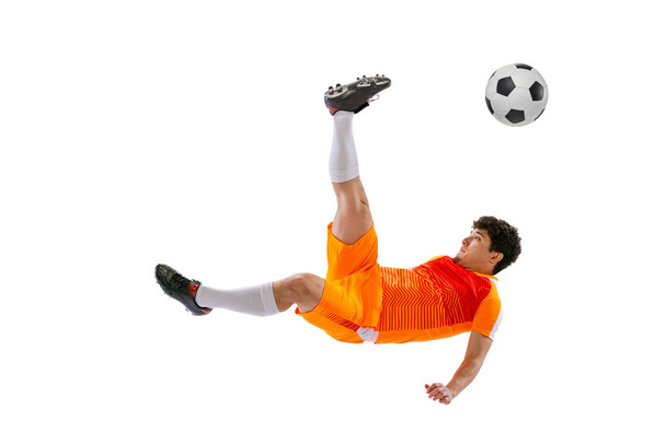 Professional football, soccer player in motion isolated on white studio background. Concept of sport, match, active lifestyle, goal and hobby - Photo, image