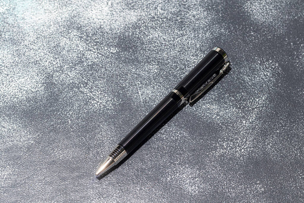 Fountain pen on a marble and gray background. Selective focus. copy space. - Photo, Image