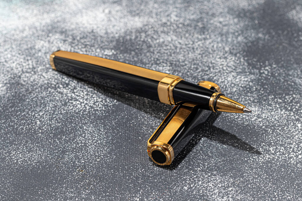 Fountain pen on a marble and gray background. Selective focus. copy space. - Photo, Image