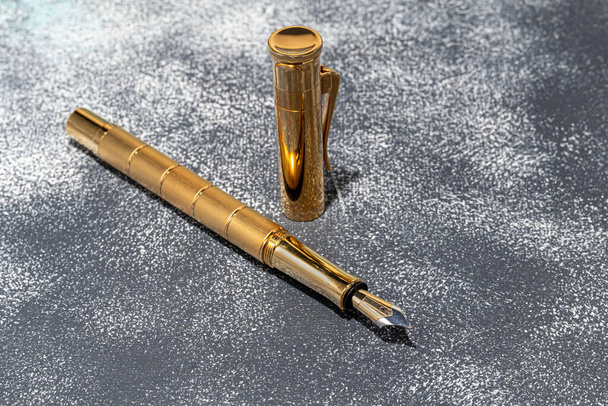 Fountain pen on a marble and gray background. Selective focus. copy space. - Foto, immagini