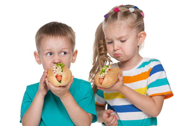 Two children with hot dogs - Photo, Image