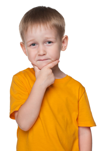 Cute little boy in a yellow shirt - Фото, изображение