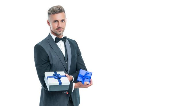 smiling man in tux with business reward box isolated on white - Foto, afbeelding