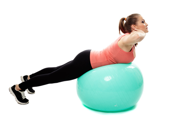 Back workout on a gym ball - Фото, изображение