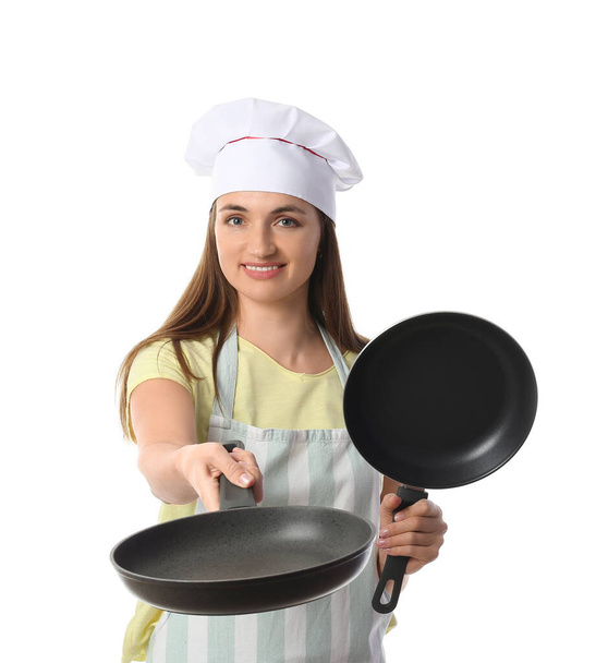 Chef femenino con sartenes sobre fondo blanco - Foto, imagen