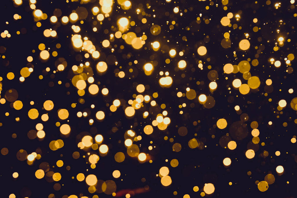 Abstract gold bokeh with black background - Photo, Image