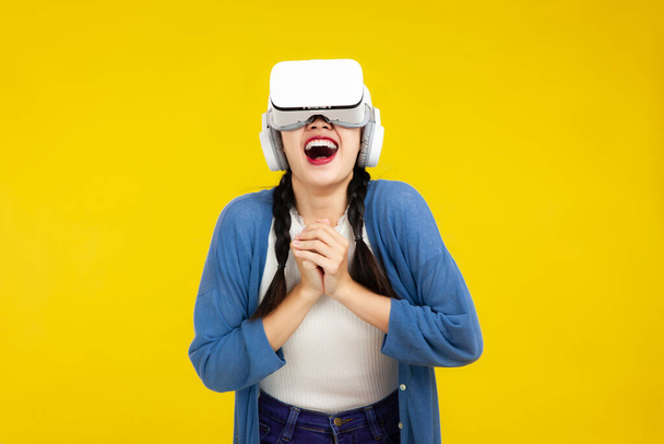 Asian woman in vr glasses isolated yellow background, People emotions with virtual reality headset, Metaverse Concepts - Foto, imagen