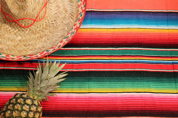 Mexico Mexican fiesta cinco de mayo background with poncho sombrero and pineapple stock, photo, photograph, image, picture, - Photo, Image