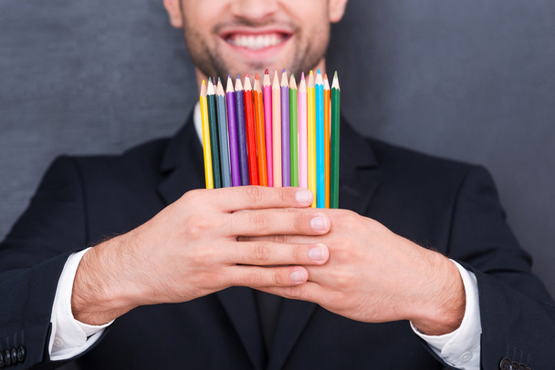 Colorful pencils in businessman hands - Fotoğraf, Görsel