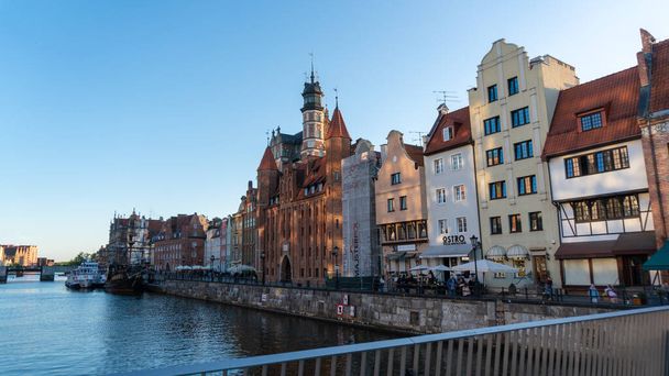 Gdansk, Poland - May 25, 2022: Beautiful scenery of the city of Gdansk over the river Motlawa, Poland. Gdansk is the historical capital of Polish Pomerania with beautiful architecture. - Zdjęcie, obraz