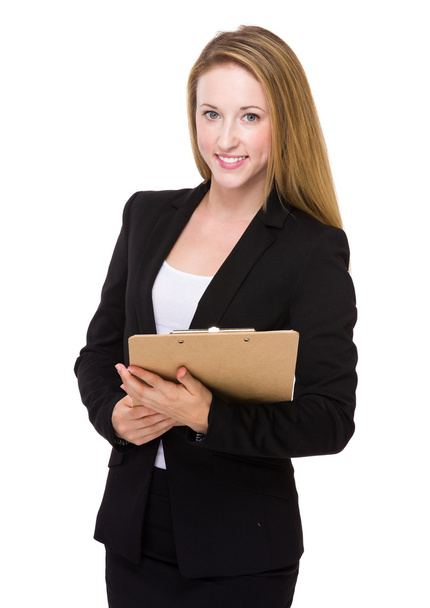 Businesswoman with clipboard - Foto, afbeelding