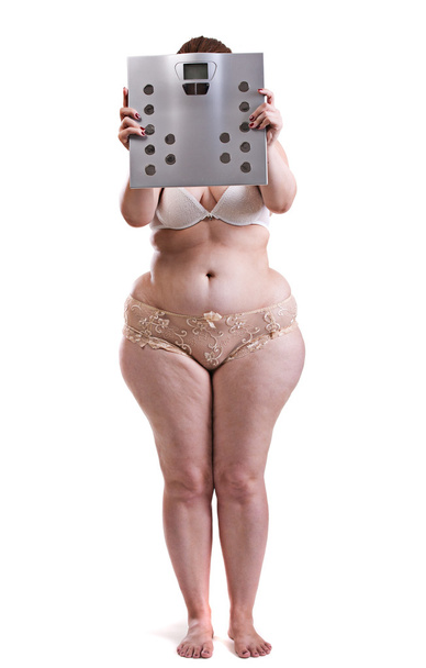 Fat woman with bathroom scales  - Photo, Image