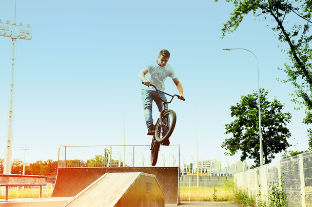 Young boy jumping with BMX - Fotó, kép