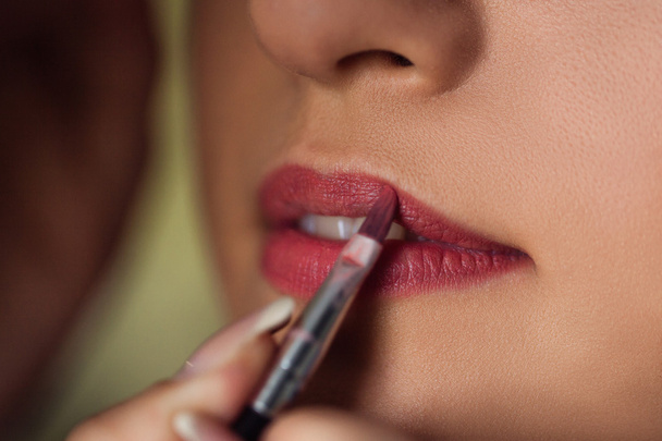 Girl lipstick brush close-up. - Photo, Image