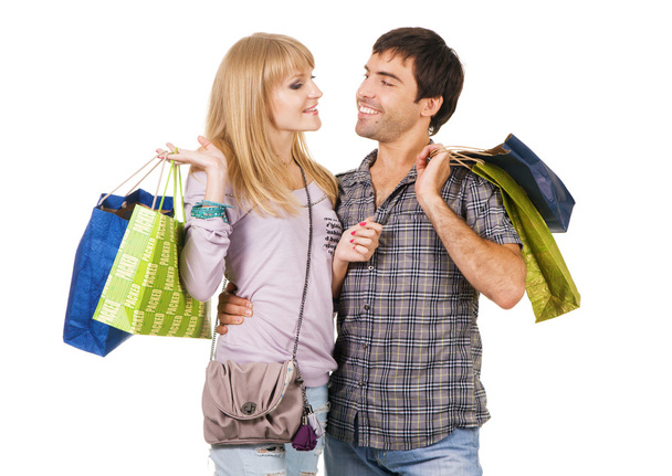 Cheerful couple with shopping bags - 写真・画像