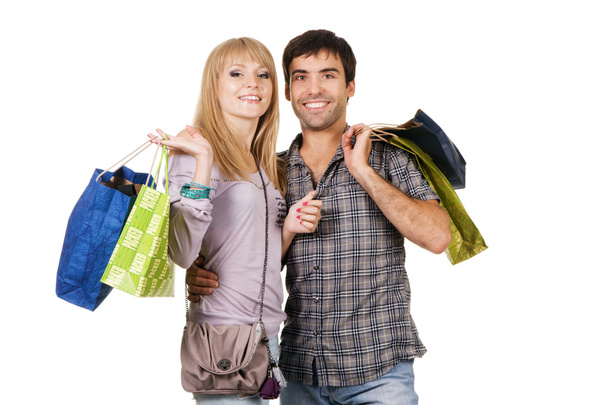 Hermosa pareja joven con bolsas de compras
 - Foto, Imagen
