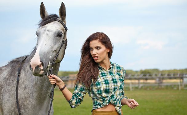Woman with a white horse - Foto, Imagen