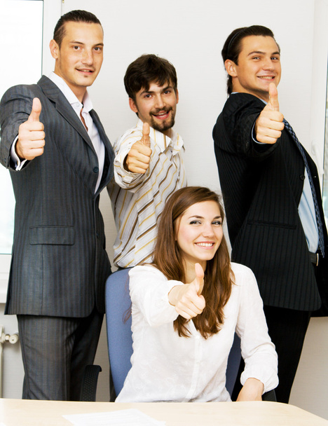 Business team di successo mostrando pollici in su
 - Foto, immagini