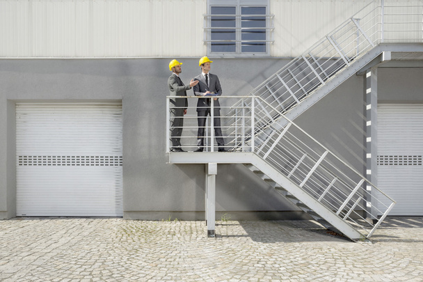 architects  discussing on stairway - Photo, Image