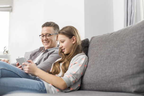 Father and daughter using digital tablet - Foto, Imagem