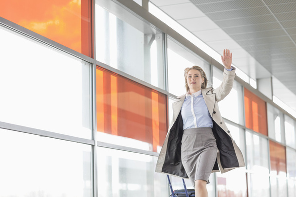 Businesswoman with luggage running - Photo, Image