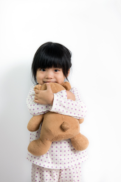 Petite fille asiatique avec ours en peluche
 - Photo, image