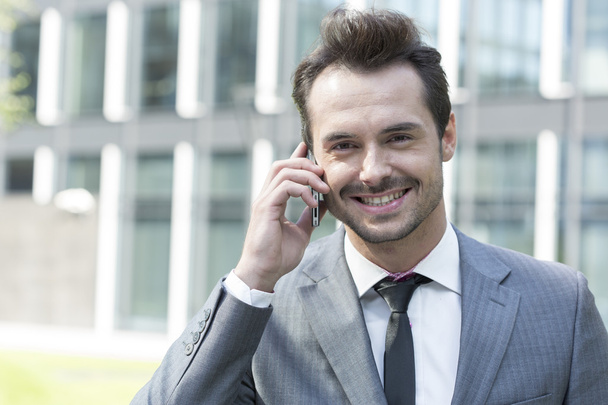 Businessman talking on cell phone - Photo, Image