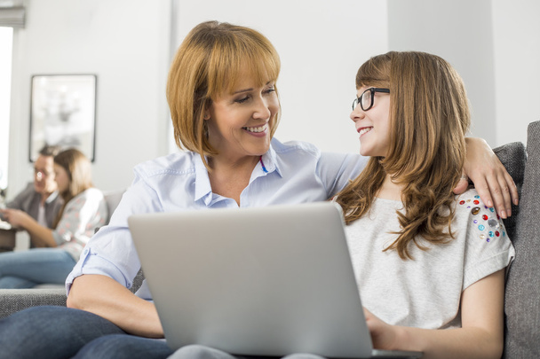 mother and daughter with laptop - Foto, Bild