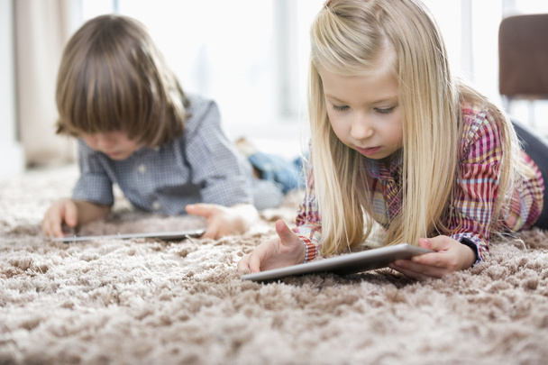 girl and brother using digital tablets - Photo, image