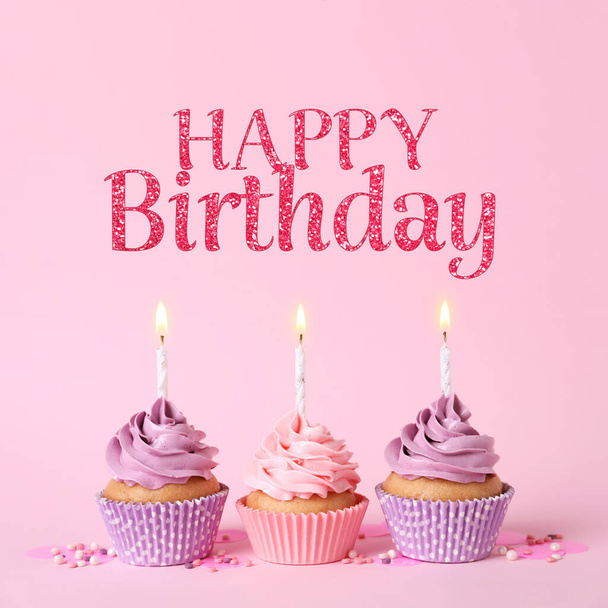 Happy Birthday. Delicious cupcakes with burning candles and sprinkles on pink background - Zdjęcie, obraz