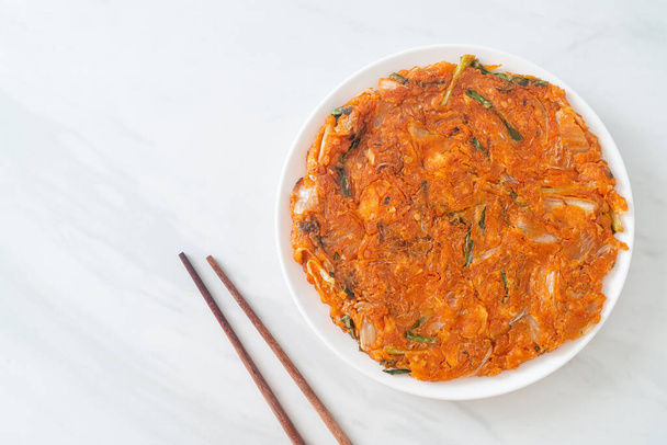 Korean Kimchi pancake or Kimchijeon - Fried Mixed Egg, Kimchi, and Flour - Korean food style - Фото, зображення