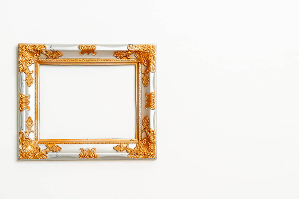 empty picture frame on white wall background with copy space - Valokuva, kuva