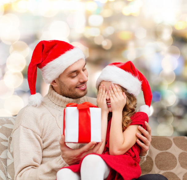 smiling daughter waiting for present from father - Photo, Image