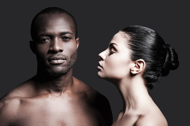 Shirtless African man and Caucasian woman - Photo, Image