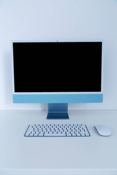 Desktop computer with wireless keyboard and mouse.  - Photo, Image