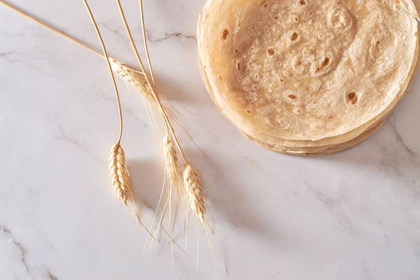 Stack of homemade wheat flour tortilla wraps for burrito - Photo, Image